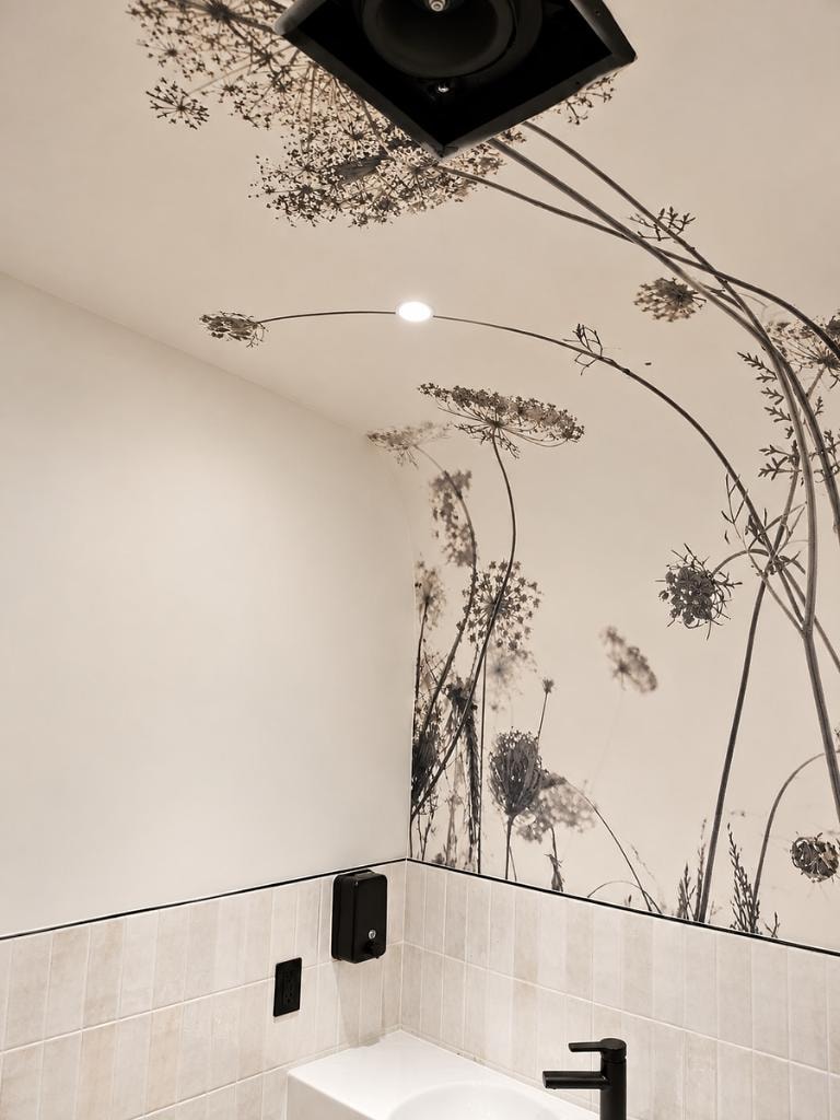 Bathroom after botanical mural wallpaper installation